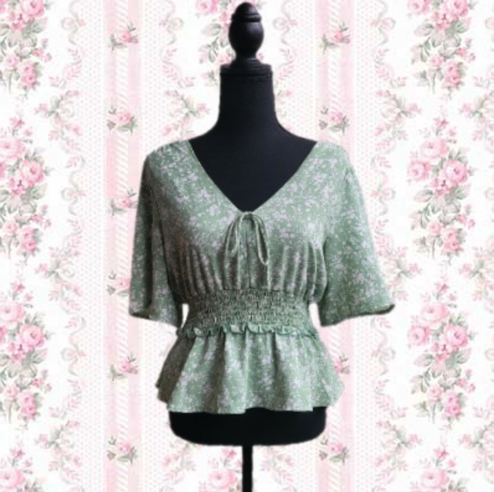 Mint green floral blouse.